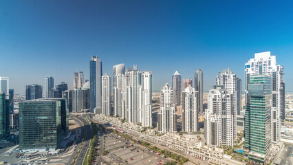 Fototapeta na wymiar Modern residential and office complex with many towers aerial timelapse at Business Bay, Dubai, UAE.