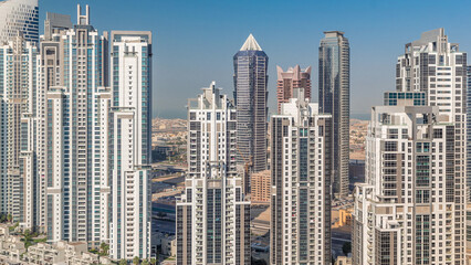 Modern residential and office complex with many towers aerial timelapse at Business Bay, Dubai, UAE.