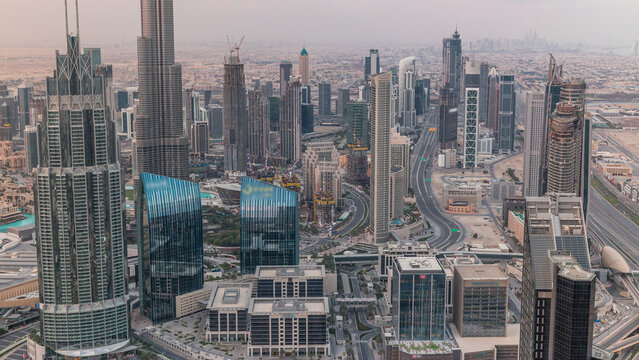 Dubai Downtown skyline futuristic cityscape with many skyscrapers and Burj Khalifa aerial timelapse.