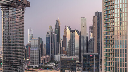 Dubai International Financial Centre district with modern skyscrapers day to night timelapse