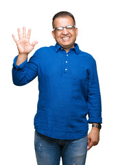 Middle age arab man wearing glasses over isolated background showing and pointing up with fingers number five while smiling confident and happy.