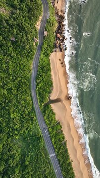 Guarda do Embaú Beach located in the state of Santa Catarina near Florianopolis. Aerial image of beach in Brazil. Vertical video.