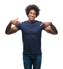 Afro american man over isolated background looking confident with smile on face, pointing oneself with fingers proud and happy.