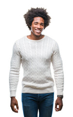 Afro american man over isolated background winking looking at the camera with sexy expression,...