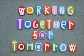 Working together for tomorrow, creative slogan composed with hand painted multi colored stone...