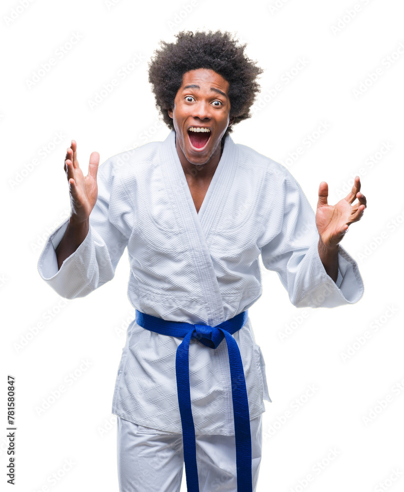 Sticker afro american man wearing karate kimono over isolated background celebrating crazy and amazed for su