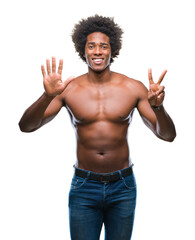 Afro american shirtless man showing nude body over isolated background showing and pointing up with fingers number seven while smiling confident and happy.