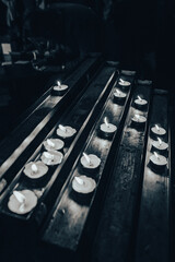 Candels in a church close up with dark background