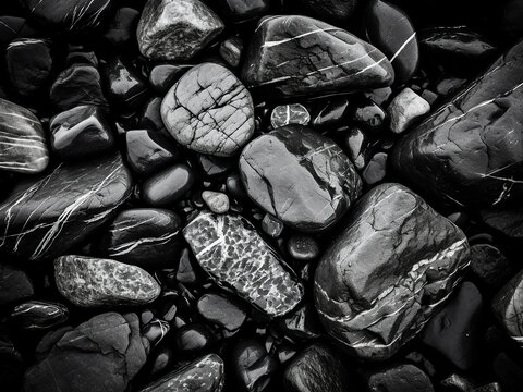 Monochrome image highlights the abstract rock background with bright light