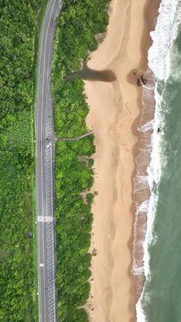 Guarda do Embaú Beach located in the state of Santa Catarina near Florianopolis. Aerial image of beach in Brazil. Vertical video.
