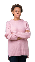 Beautiful young african american woman over isolated background skeptic and nervous, disapproving...