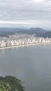 Guarda do Embaú Beach located in the state of Santa Catarina near Florianopolis. Aerial image of beach in Brazil. Vertical video.
