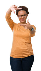 Young beautiful african american woman wearing glasses over isolated background smiling making...