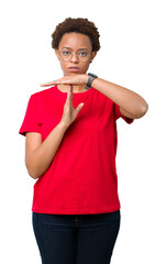 Beautiful young african american woman wearing glasses over isolated background Doing time out...