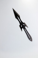 Black knife on white background. isolated, selective focus.