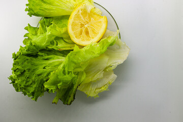 fresh salad with lemon, selective focus, isolated background.
