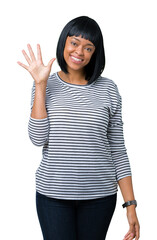 Beautiful young african american woman wearing stripes sweater over isolated background showing and pointing up with fingers number five while smiling confident and happy.