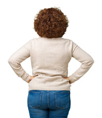 Beautiful middle ager senior woman wearing turtleneck sweater and glasses over isolated background standing backwards looking away with arms on body