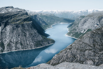 Landscape with blue sky, lake and mountains in Norway, Trolltunga