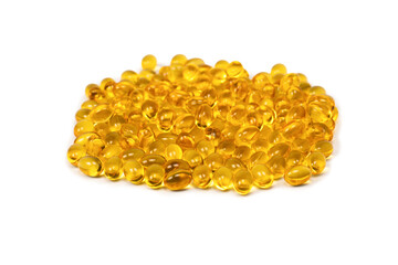 A group of yellow capsules isolated on a white background.