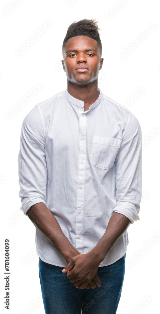 Wall mural Young african american man over isolated background with serious expression on face. Simple and natural looking at the camera.