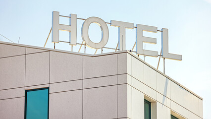 White 3d Sign Hotel at Top of Building