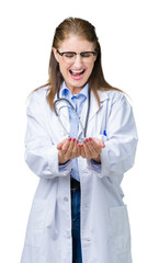 Middle age mature doctor woman wearing medical coat over isolated background Smiling with hands palms together receiving or giving gesture. Hold and protection