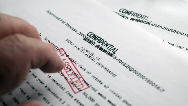 Finger tapping on top secret document