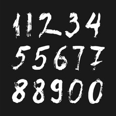 Set of calligraphic numbers painted by white brush on isolated black background. Lettering for your design. Vector illustration.