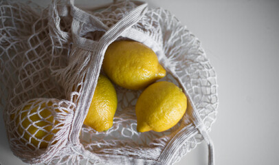 Lemons in a string bag
