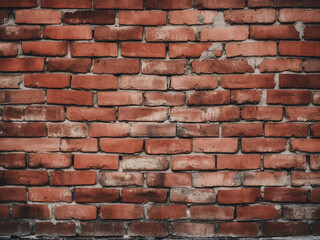 Obraz premium Textured backdrop featuring the structural red bricks of aged wall