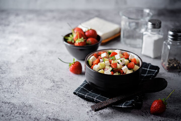 Strawberry cucumber Feta cheese salad in a bowl