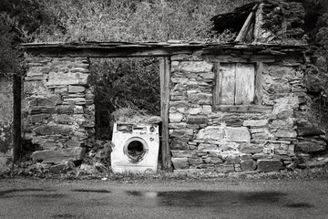 Old Washing Machine in the ruins of an old rustic house - Las Herrerias, Vega de Valcarce, El Bierzo, province of Leon, Castille and Leon, Spain