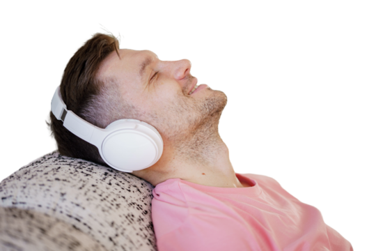 A man listens to a podcast and music playlist on headphones. Isolated background. - Powered by Adobe