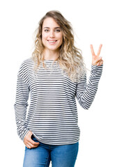 Beautiful young blonde woman wearing stripes sweater over isolated background showing and pointing up with fingers number two while smiling confident and happy.