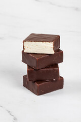 Vegan dessert. Vanilla souffle in chocolate glaze. Bird's milk.  Close-up