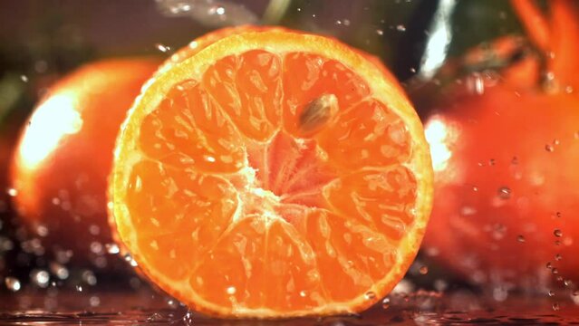 Super slow motion fresh tangerines. High quality FullHD footage