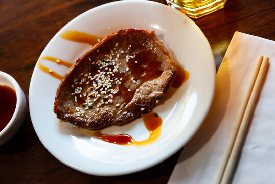 Appetizing beef steak served with sweet teriyaki sauce. Popular Japanese dish