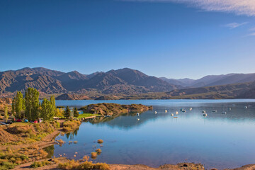 Lake Potrerillos on a sunny day, in Mendoza, Argentina. Elevated view.