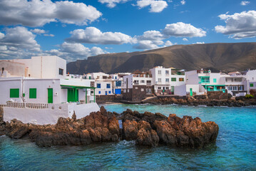View of Punta Mujeres Village with white houses, on the coast of Lanzarote Island at the foot of...