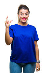 Young beautiful woman wearing casual blue t-shirt over isolated background smiling and confident gesturing with hand doing size sign with fingers while looking and the camera. Measure concept.