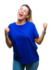 Young beautiful woman wearing casual blue t-shirt over isolated background very happy and excited...
