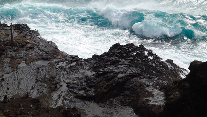 waves crashing on rocks