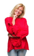 Middle age blonde woman over isolated background looking confident at the camera with smile with crossed arms and hand raised on chin. Thinking positive.