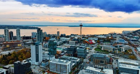 Beautiful panorama of Seattle with its famous Space Needle tower at the backdrop of Lake Washington. City view at dusk from aerial perspective.