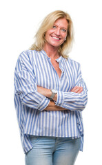 Middle age blonde business woman over isolated background happy face smiling with crossed arms looking at the camera. Positive person.