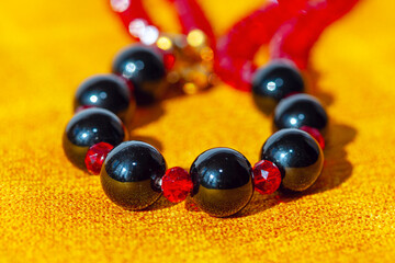 Necklace with beads made by precious stone