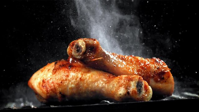 Super slow motion Chicken legs are fried in a pan. High quality FullHD footage