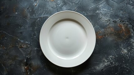 Plate on black table with fork and knife