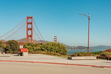 Golden Gate Bridge viewed from a vantage point with a clear blue sky in the background.